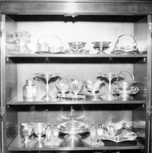 Silver in china cabinet, east wall