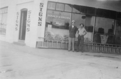 Don in front of his sign shop, 116 Trimble Court, Fort Collins, c. 1956
