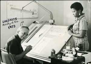 Donald Brown at his desk in Barbados