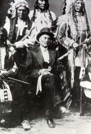 Antoine Janis in top hat with a group of Indians
