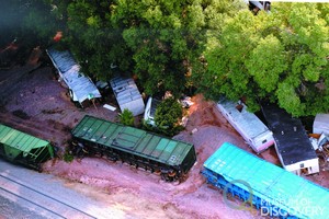 Derailed train cars and uprooted mobile homes after Spring Creek Flood