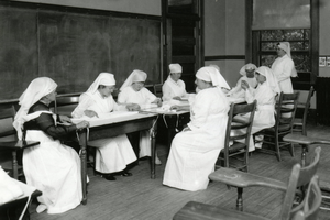 Red Cross volunteers folding bandages during WWI