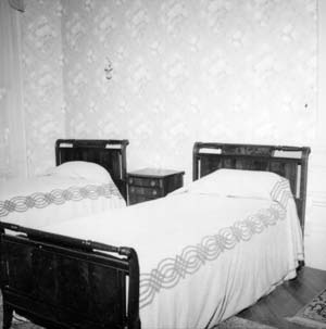 Twin beds on south wall