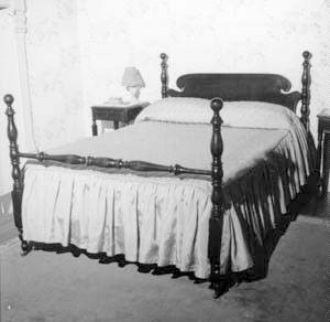 Looking at bed and northwest corner