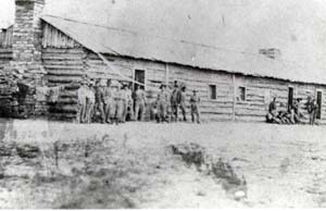 Soldiers in front of building, professional enlisted barracks, old military Fort Collins, c. 1865